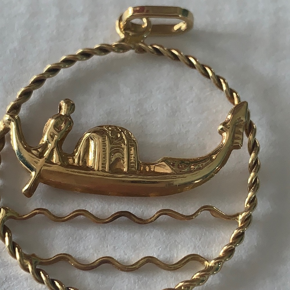 It’s in gold 1973 necklace